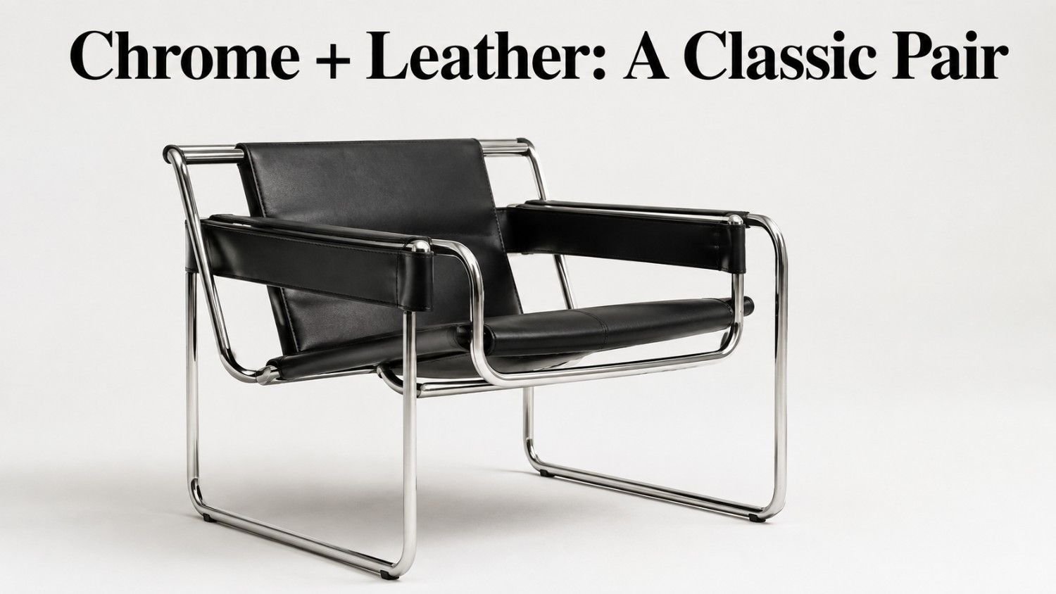 Chrome-framed accent chair with black leather upholstery on a white studio background.
