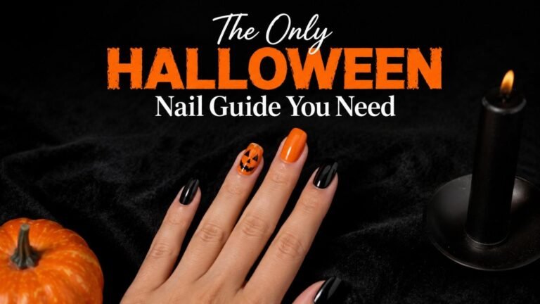 Hand with classic Halloween nails in alternating orange and black, featuring a hand-painted pumpkin accent nail.