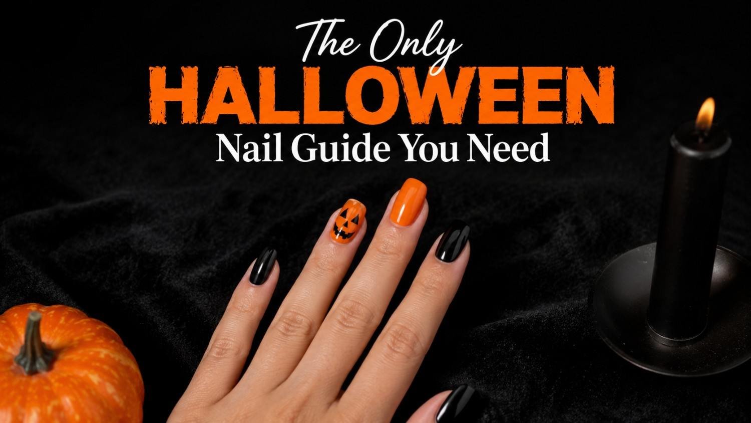 Hand with classic Halloween nails in alternating orange and black, featuring a hand-painted pumpkin accent nail.
