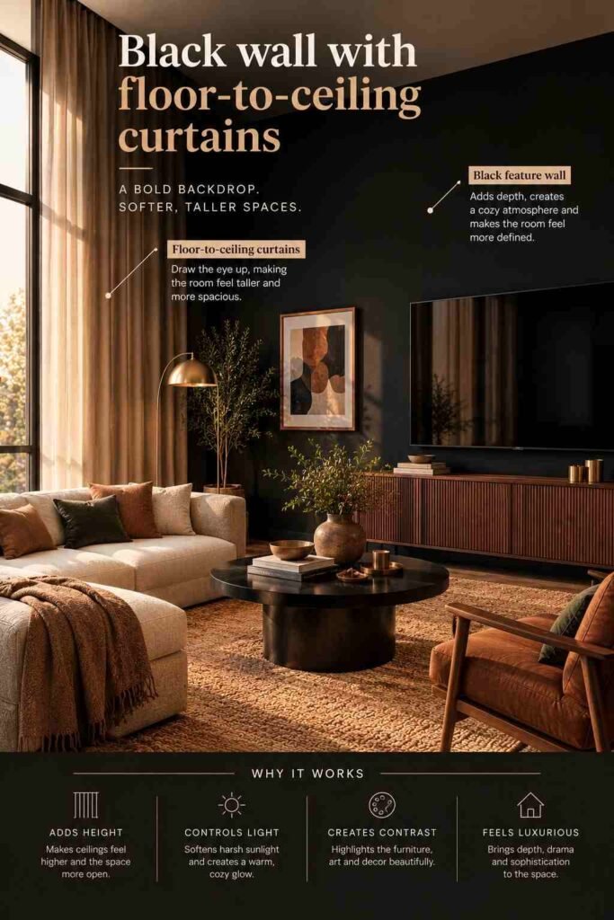 Warm modern living room featuring a dramatic black feature wall, floor-to-ceiling taupe curtains, cream sofa, walnut media console, brass accents, and natural textures.
