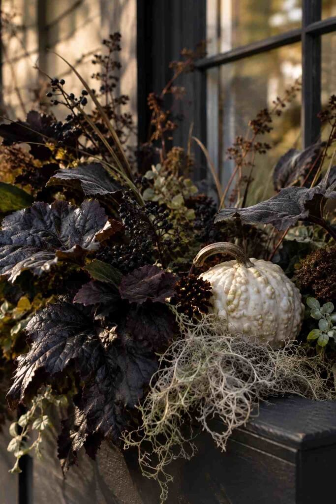 Halloween Window Boxes: Spooky, Elegant & Budget-Friendly Ideas for Every Home 2 Close-up of dark foliage, dried moss, and gourd texture in a Halloween window box