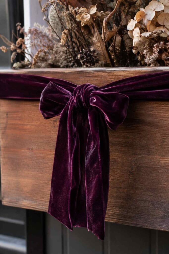 Halloween Window Boxes: Spooky, Elegant & Budget-Friendly Ideas for Every Home 11 Dark velvet ribbon wrapped along the rim of an elegant Halloween window box
